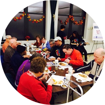 group of elderly people eating in a table